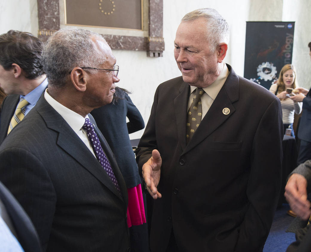 Charles Bolden conversing in the Rayburn House Office Building in Washington.