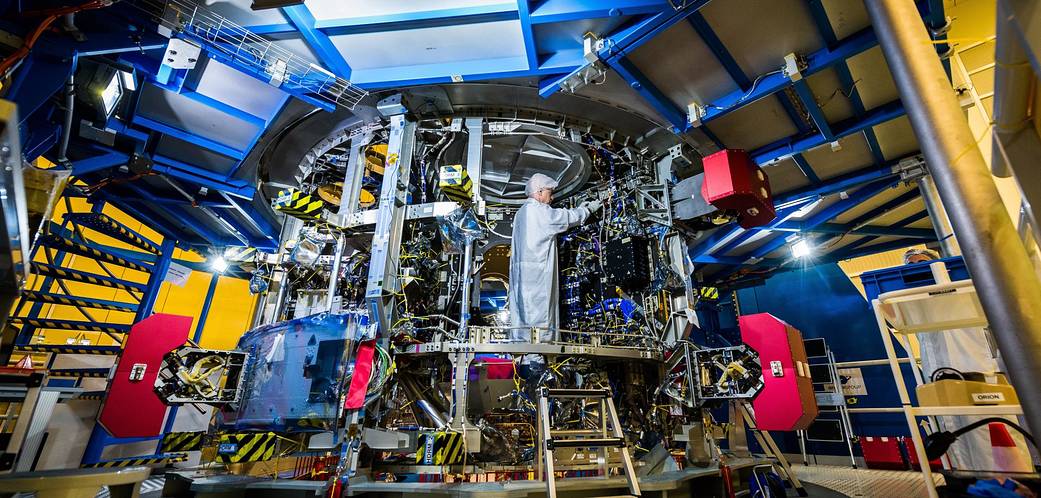 A technician works on the European Service Module that will propel the Orion spacecraft in space.