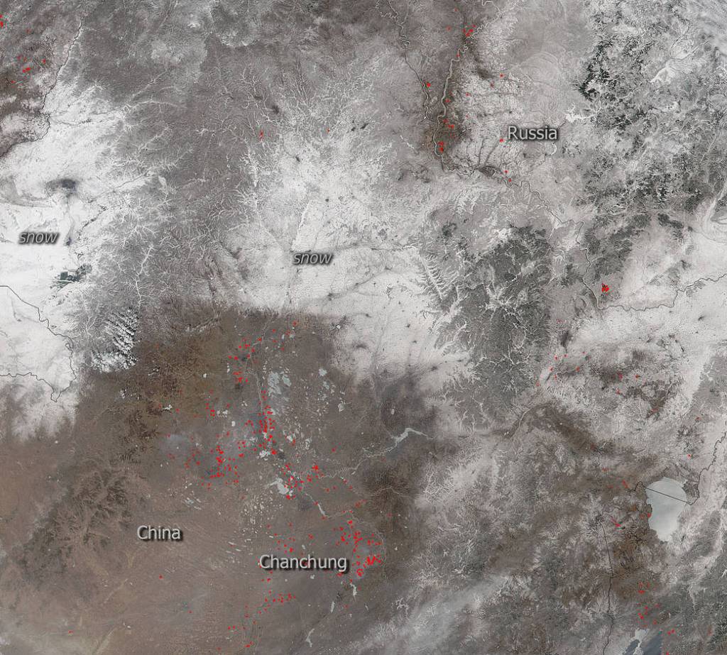 Snow and Fire Juxtaposed in China and Russia