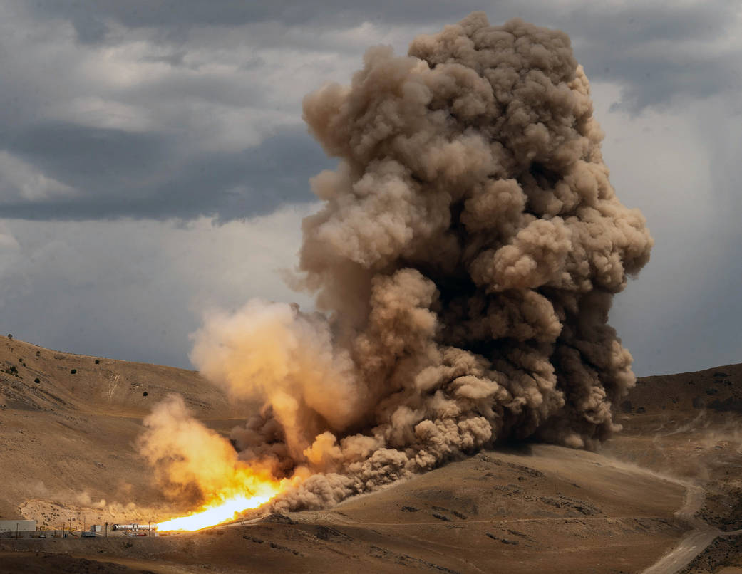 A single solid rocket booster motor fires up at Northrop Grumman’s test facility in Promontory, Utah, on July 21. 