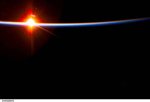 View of a sunrise on Earth taken from STS-107
