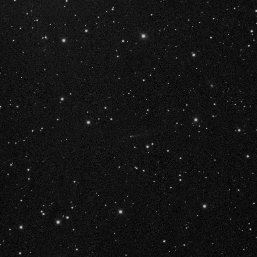 Comet 209P/LINEAR shining faintly among the stars of Ursa Major on April 30, 2014.