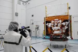 Photographers take close-up shots of NASA's Gamma-Ray Large Area Space Telescope (GLAST) spacecraft during a media showing at Astrotech's processing facility near the Kennedy Space Center in Florida.