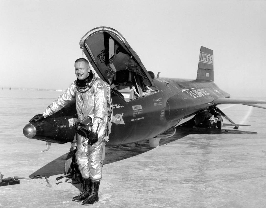 This photograph shows Neil Armstrong next to the X-15 rocket-powered aircraft after a research flight. He was one of only 12 pil