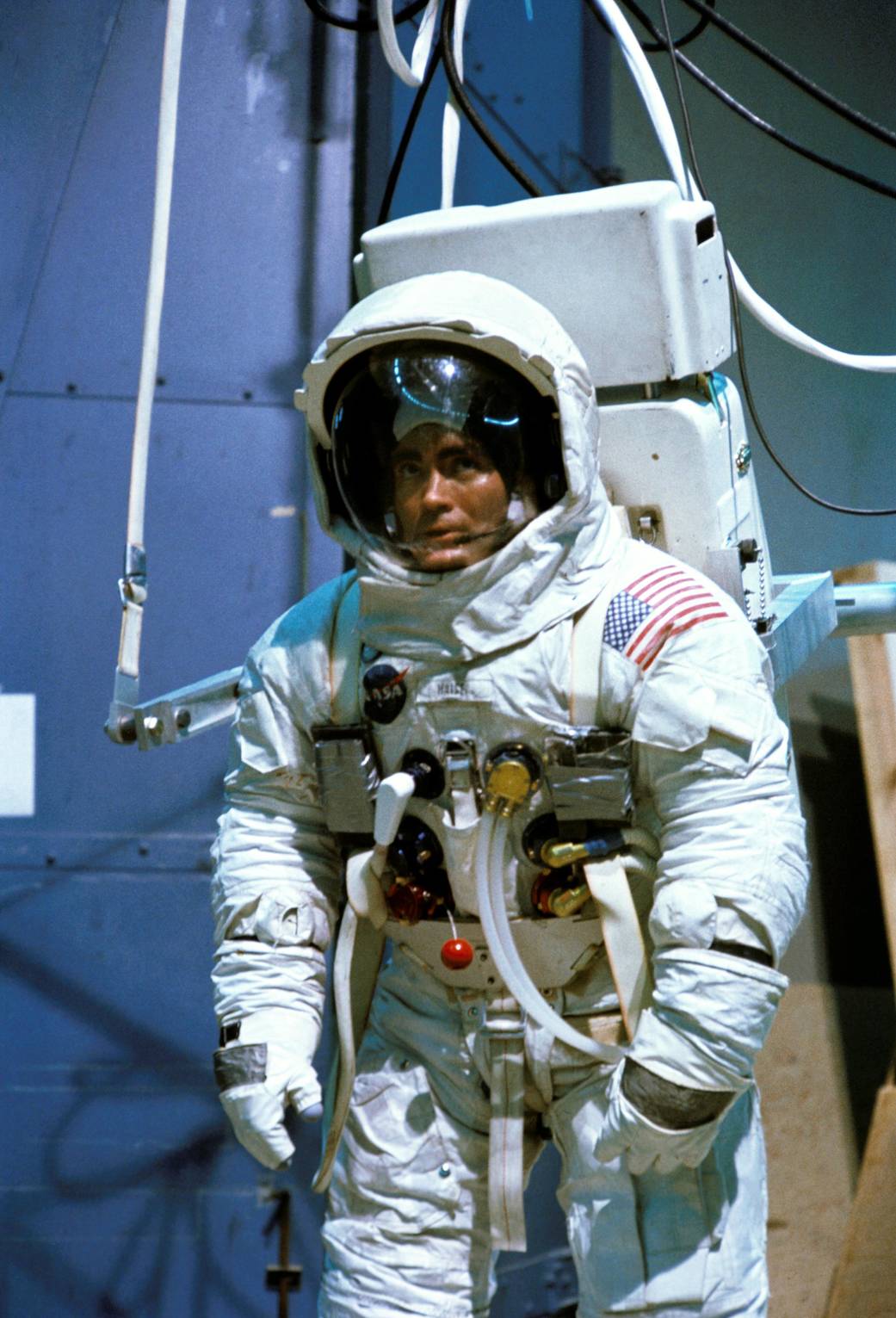 Astronaut in spacesuit with visor open during training activities