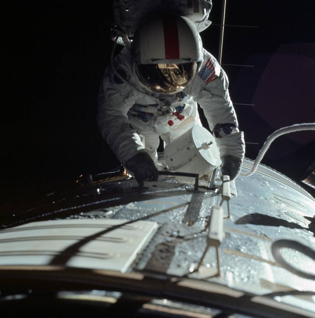 Astronaut in spacesuit working outside Apollo lunar module