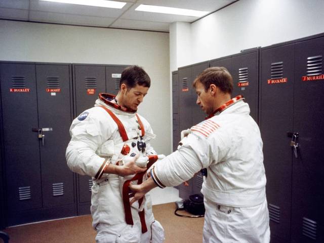 Paul Weitz and Joe Kerwin try on their spacesuits at Johnson Space Center during training