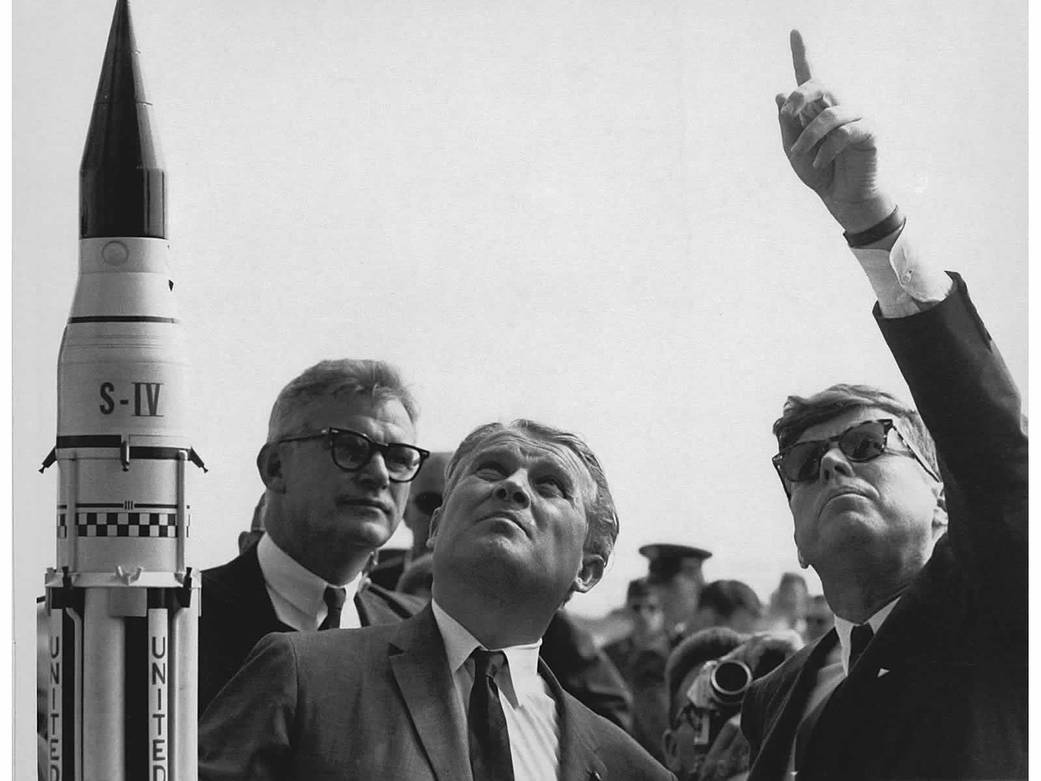 Wernher von Braun and President John F. Kennedy look upward