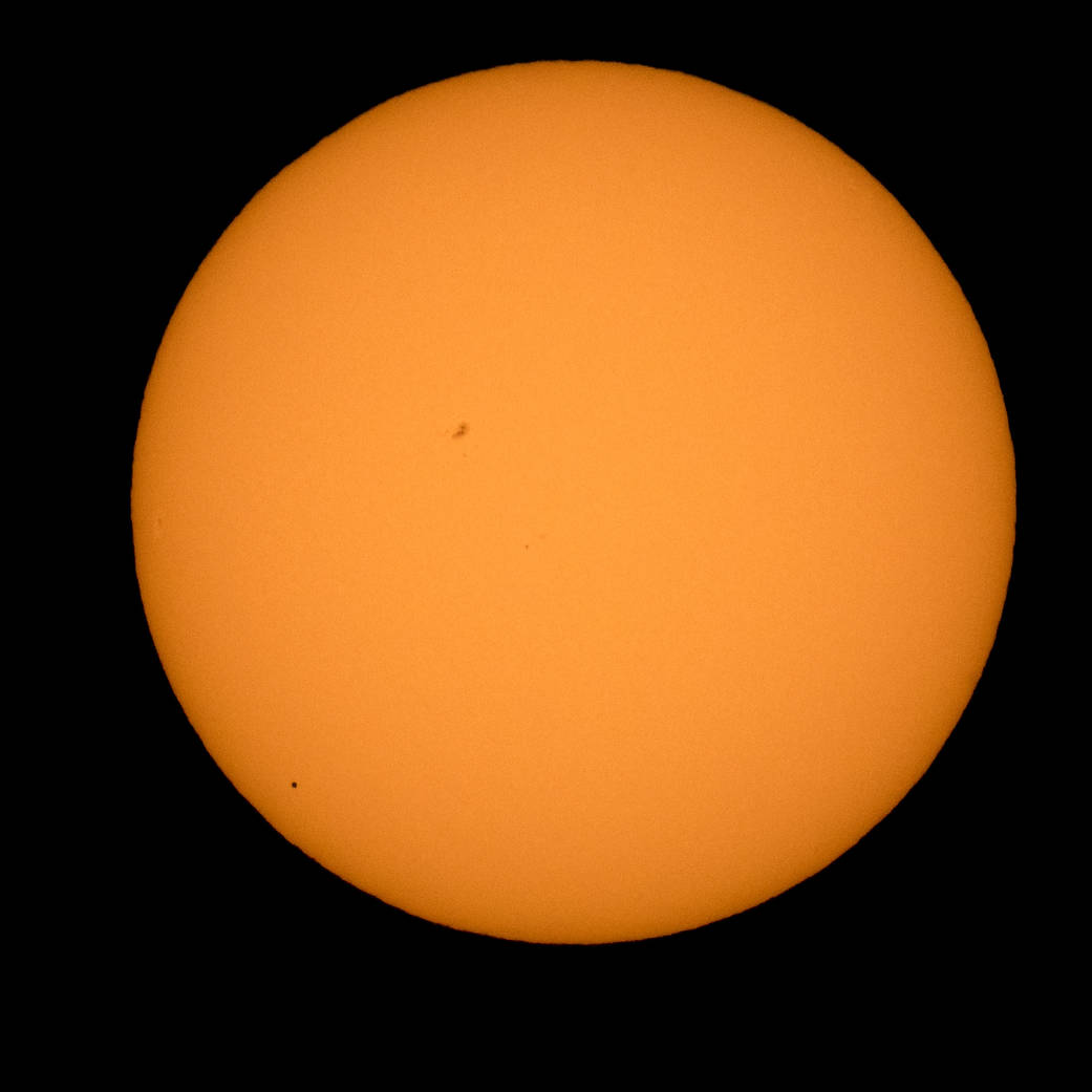 The planet Mercury is seen in silhouette, lower left, as it transits across the face of the sun Monday, May 9, 2016, Boyertown, 