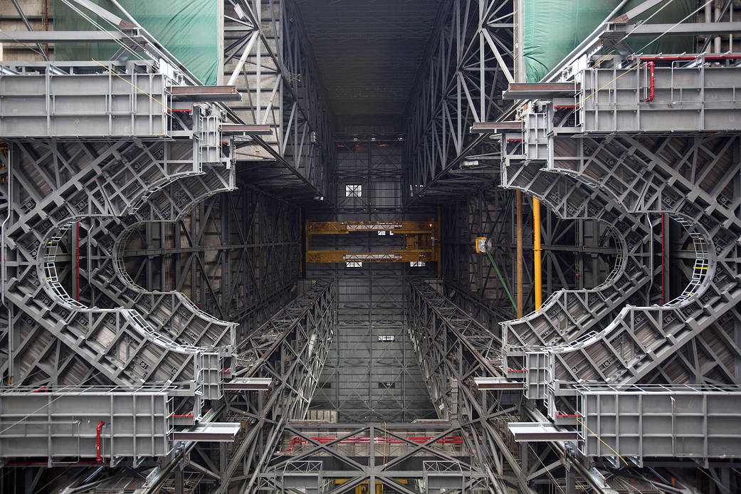 View from floor of large Vehicle Assembly Building with platform structures visible going upwards