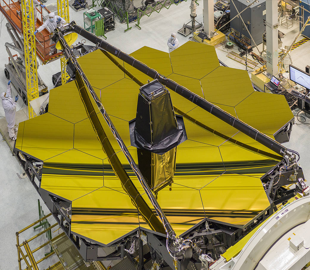 Overhead view of Webb Telescope with hexagonal gold mirrors uncovered 