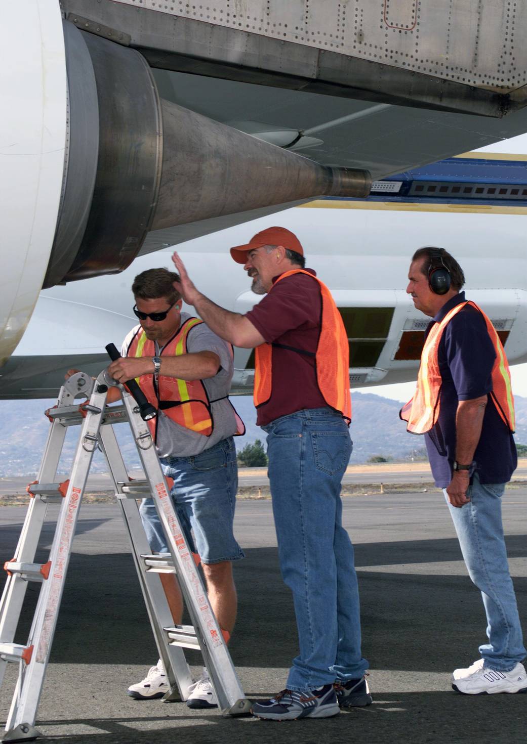 NASA Dryden DC-8 Maintenance Crew Members Inspect the Aircraft