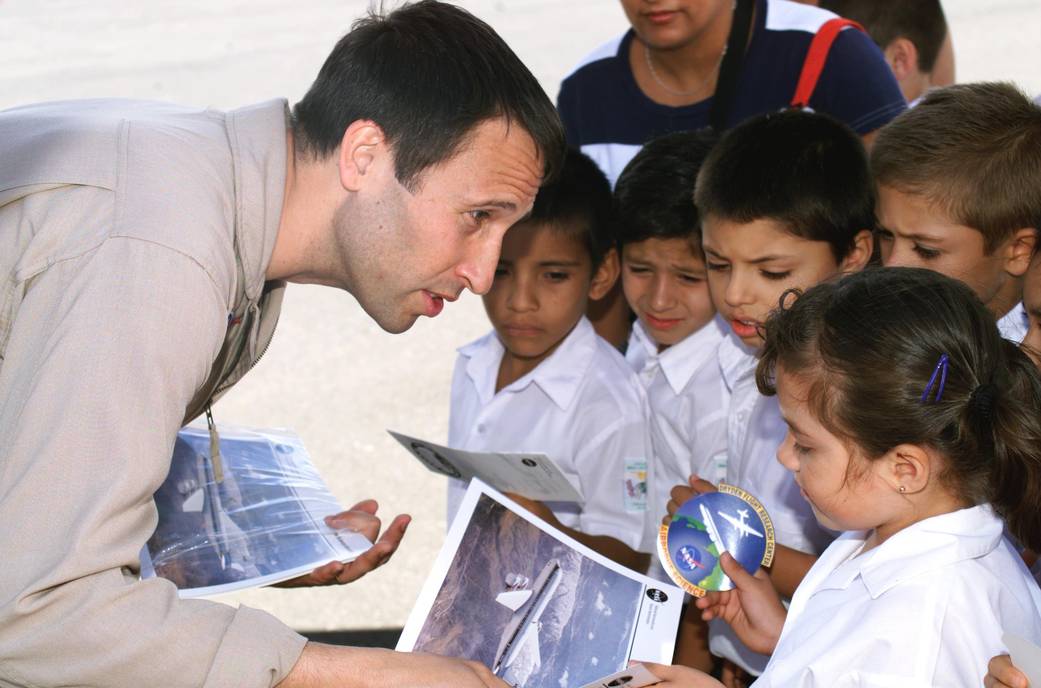 DC-8 Mission Manager Walter Klein Gives NASA Products to School Children