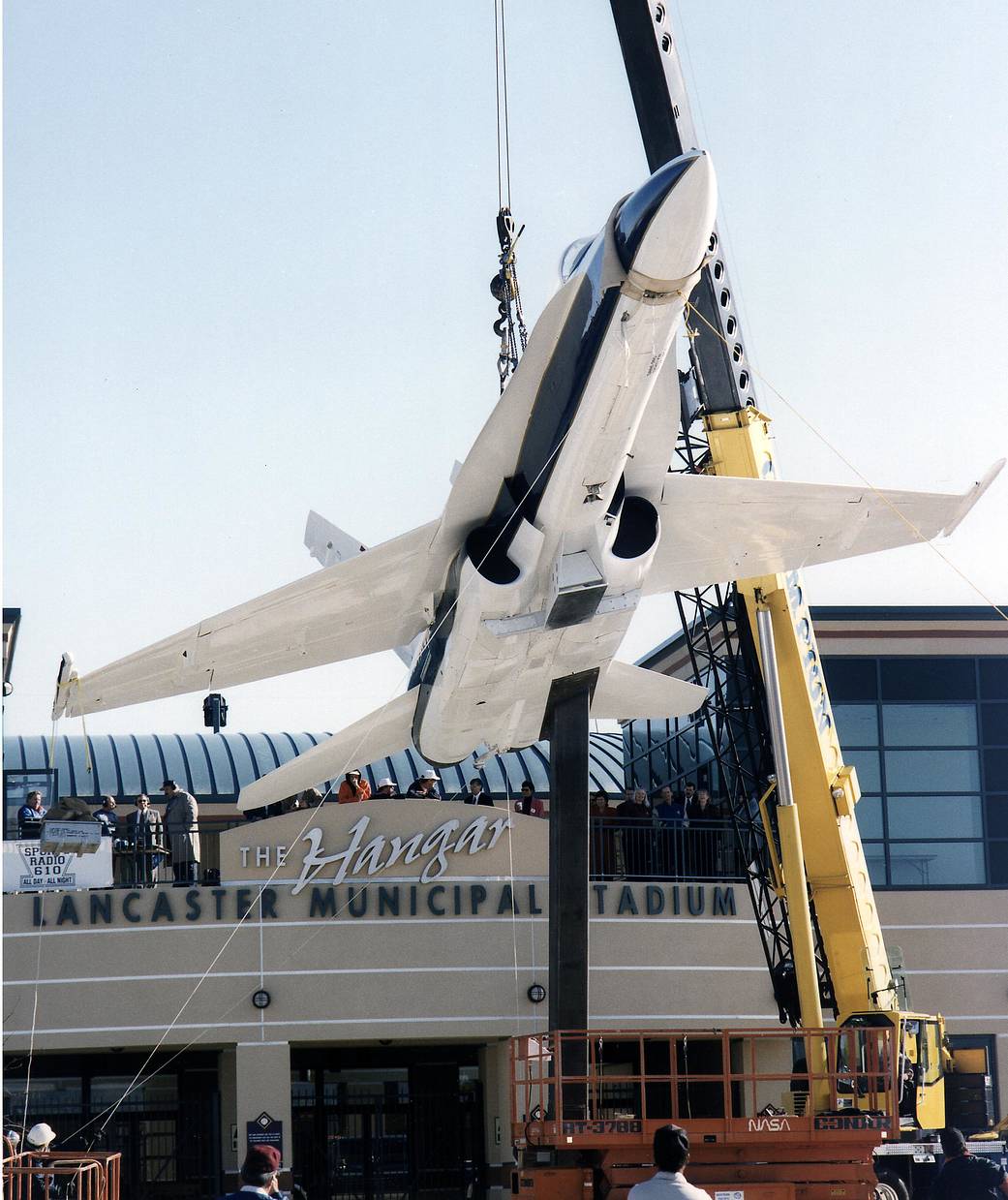 F/A-18 being lifted by a crane at Jethawks Stadium