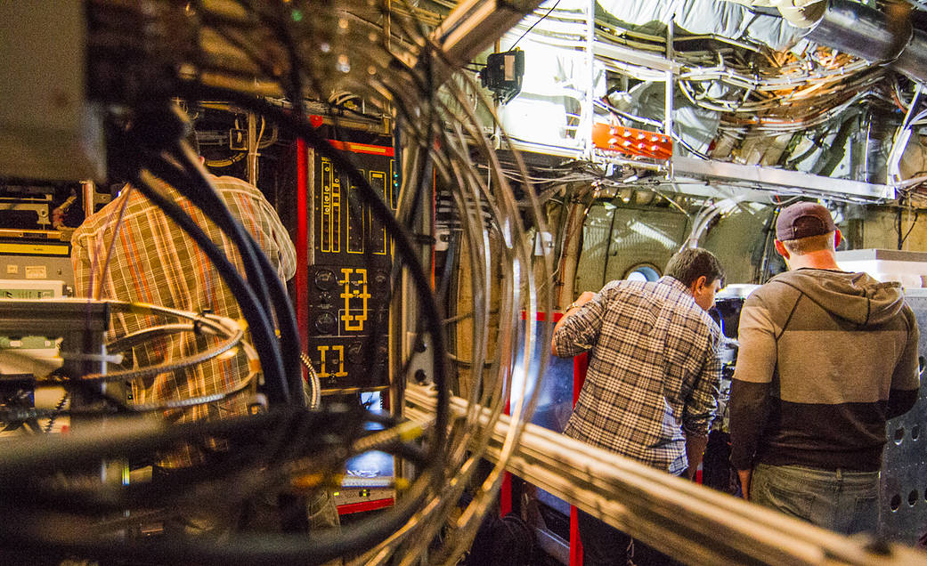 Wires, tubes, electronic equipment and people in a plane