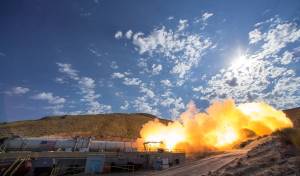 Rocket booster horizontal on ground fires up for test