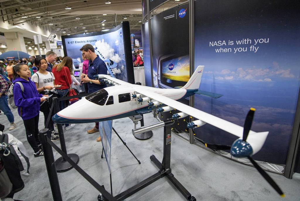 Attendees Listen to a NASA Staff Member Speak About the X-57