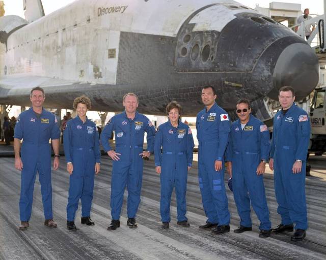 STS-114 Crew in Front of the Shuttle Discovery