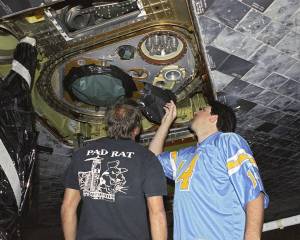 STS-114 Technicians Inspect External Tank Fittings on Shuttle Discovery