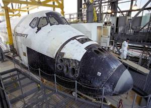STS-114 Technician leaves the Space Shuttle Discovery's 'white room'