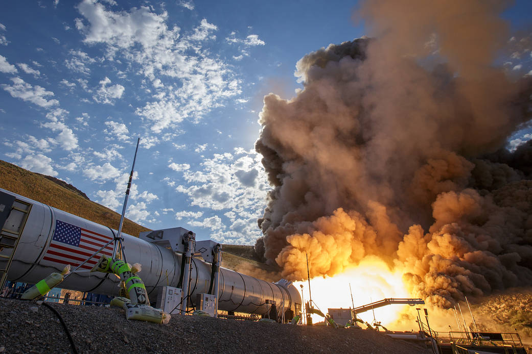 Rocket booster horizontal on ground fires up for test