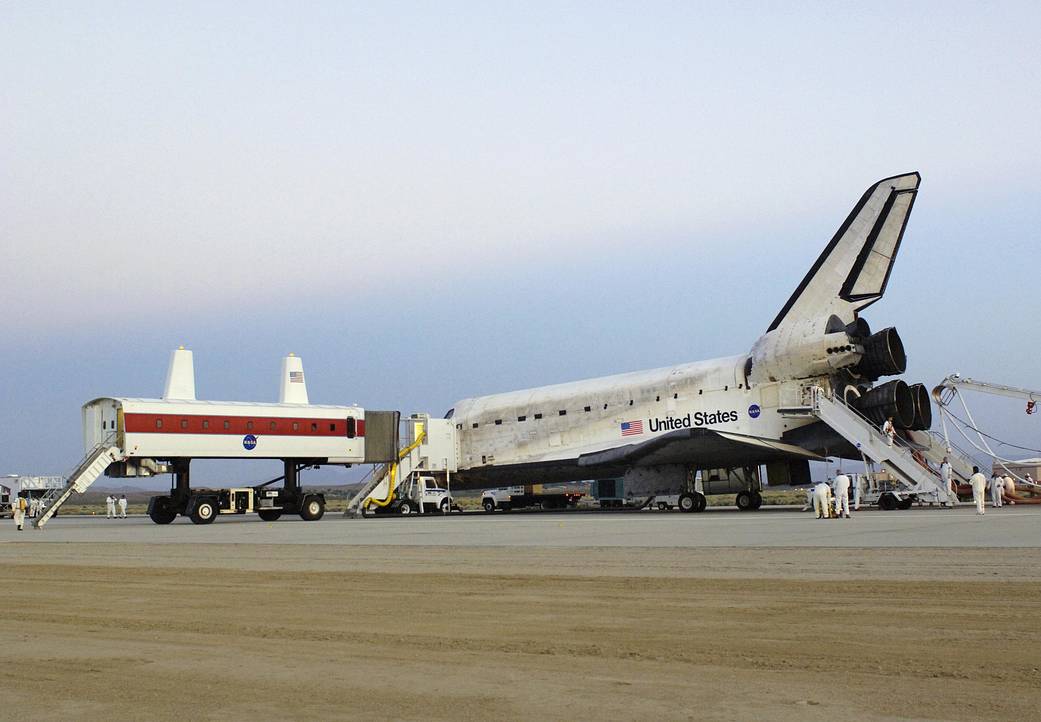 STS-114 NASA's Crew Transport Vehicle Pulls Up to the Shuttle Discovery