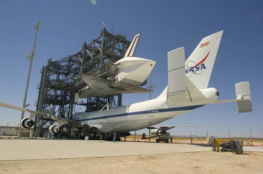 747 Shuttle Carrier Aircraft is Positioned Under the Shuttle Discovery