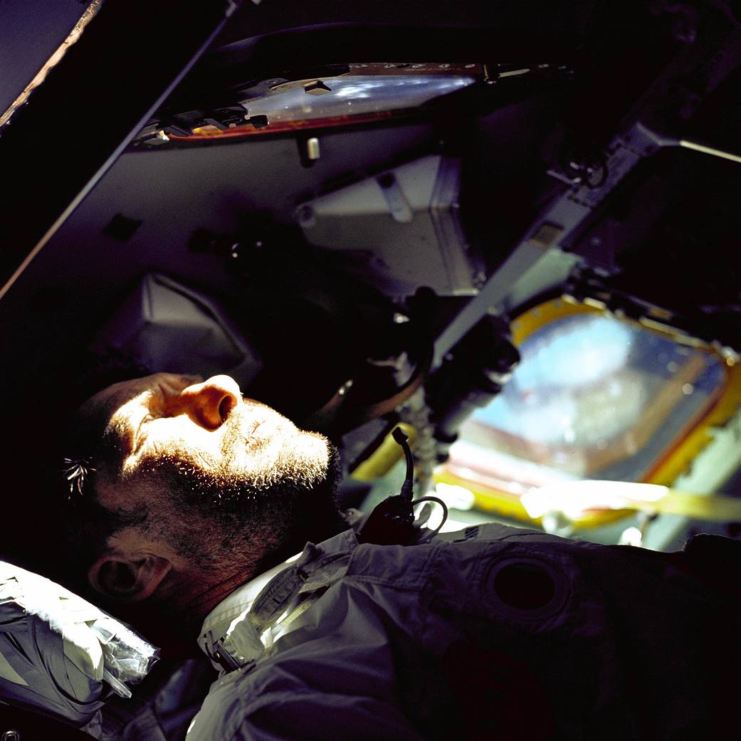 Closeup image of the face of Apollo 7 commander Walter Schirra inside spacecraft