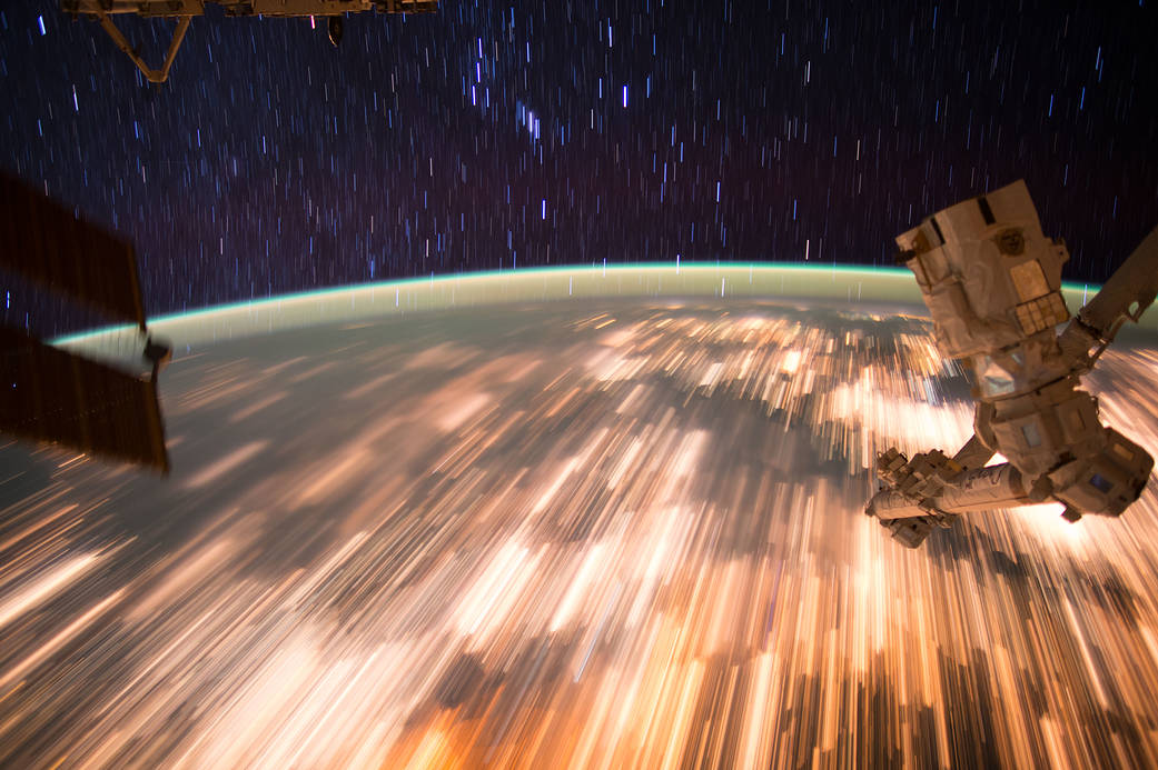 Long exposure image shows Earth lights and star trails from low Earth orbit