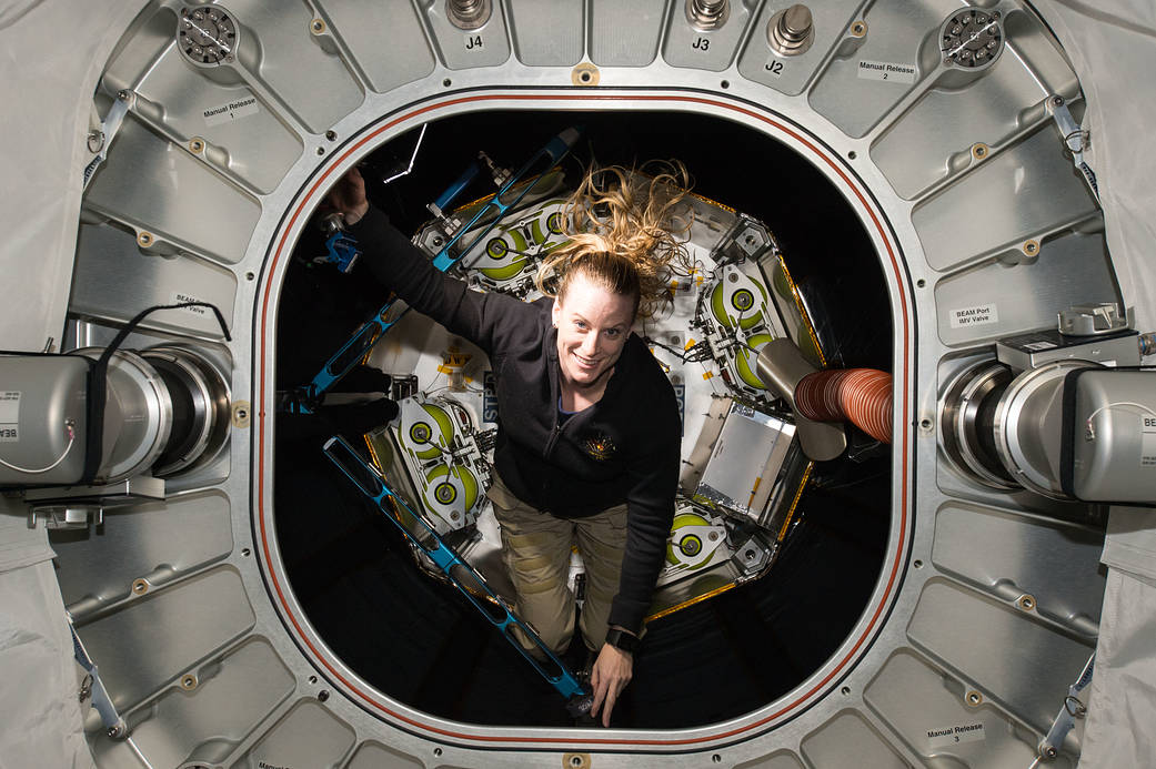 NASA astronaut Kate Rubins exiting space station habitat module