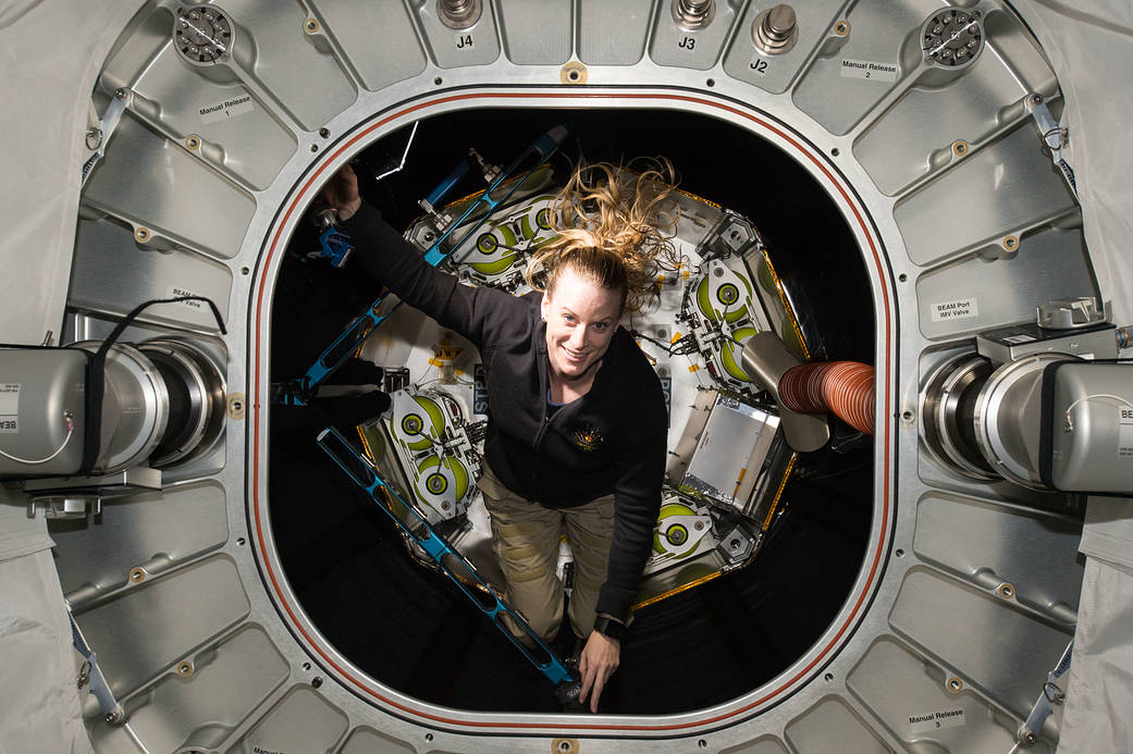 NASA astronaut Kate Rubins exiting space station habitat module
