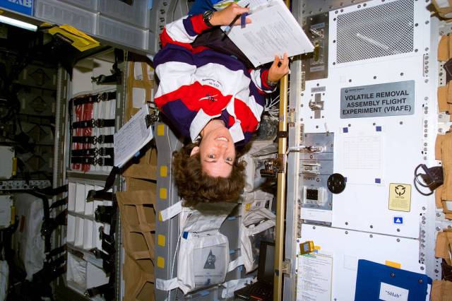 Ellen Ochoa floating upside down on STS-96