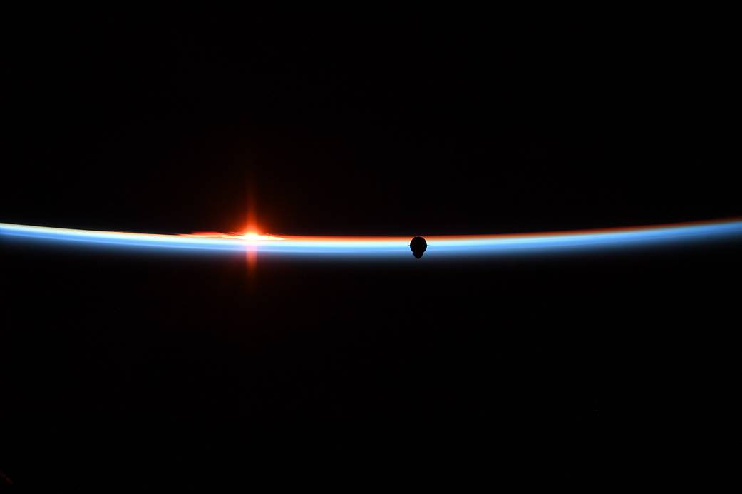 Horizon with SpaceX Crew Dragon approaching in orbit