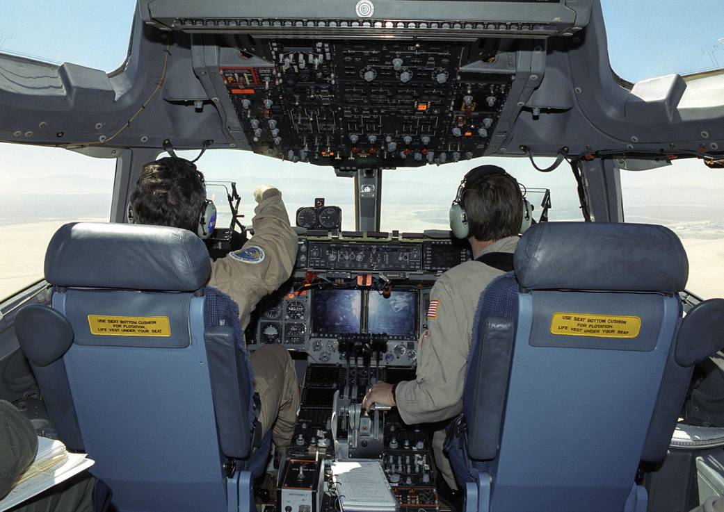 NASA research pilots Jim Smolka and Frank Batteas fly a variety of landing profiles in an Air Force C-17.