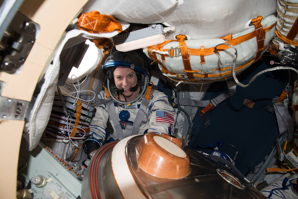 NASA astronaut Kate Rubins in Sokol suit inside Soyuz spacecraft