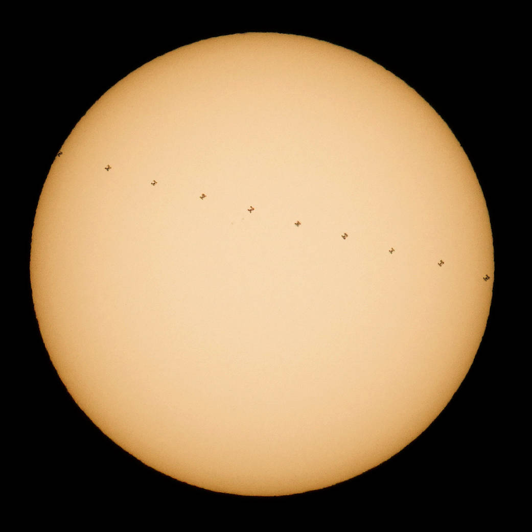 Composite image of sun with space station transiting