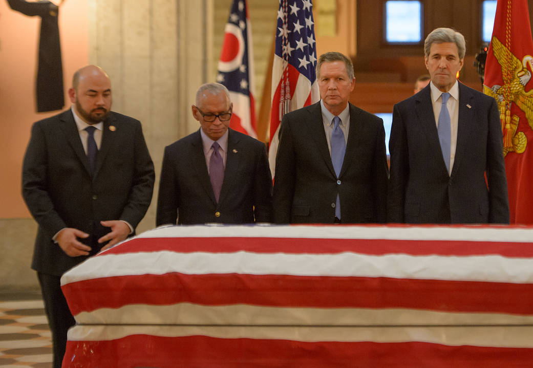 Speaker Rosenberger, NASA Administrator Bolden, Governor Kasich and Secretary of State Kerry at flag-draped casket of Sen. Glenn