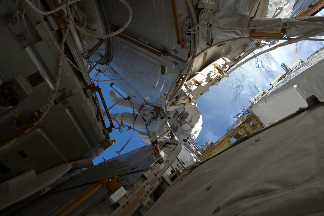 NASA astronaut Shane Kimbrough in space suit working outside the International Space Station