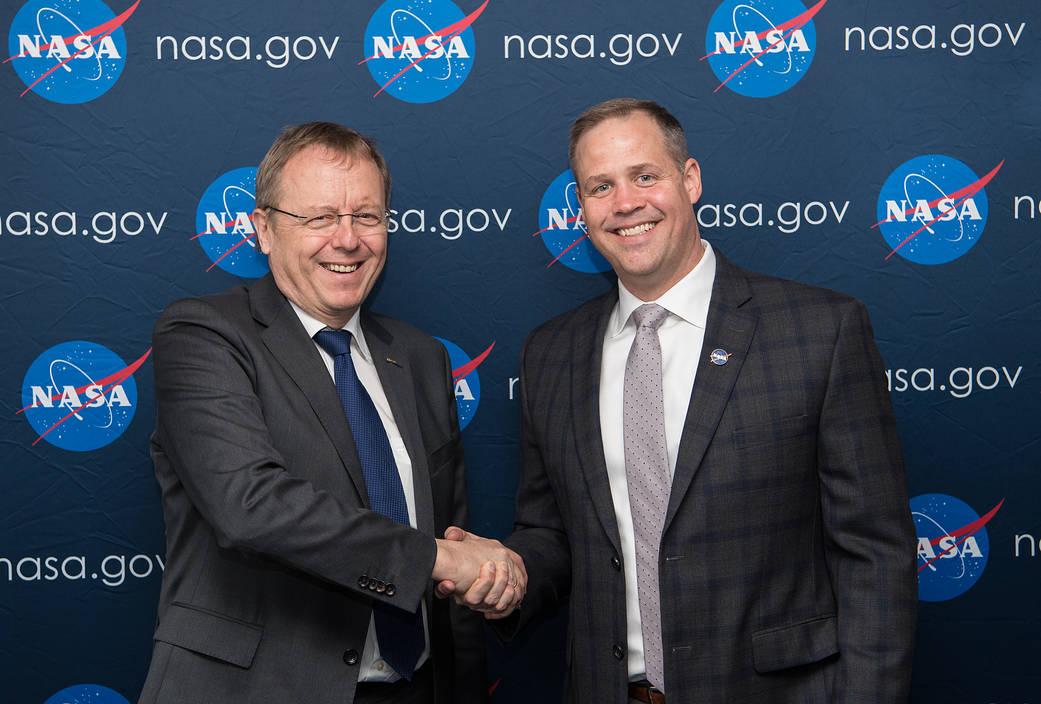 NASA administrator shakes hands with ESA director general