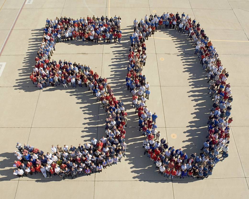 Staff at NASA Dryden Flight Research Center spell out the number 50 on the ramp