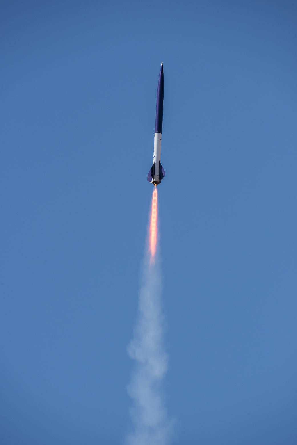 Launch of student built rocket into blue sky