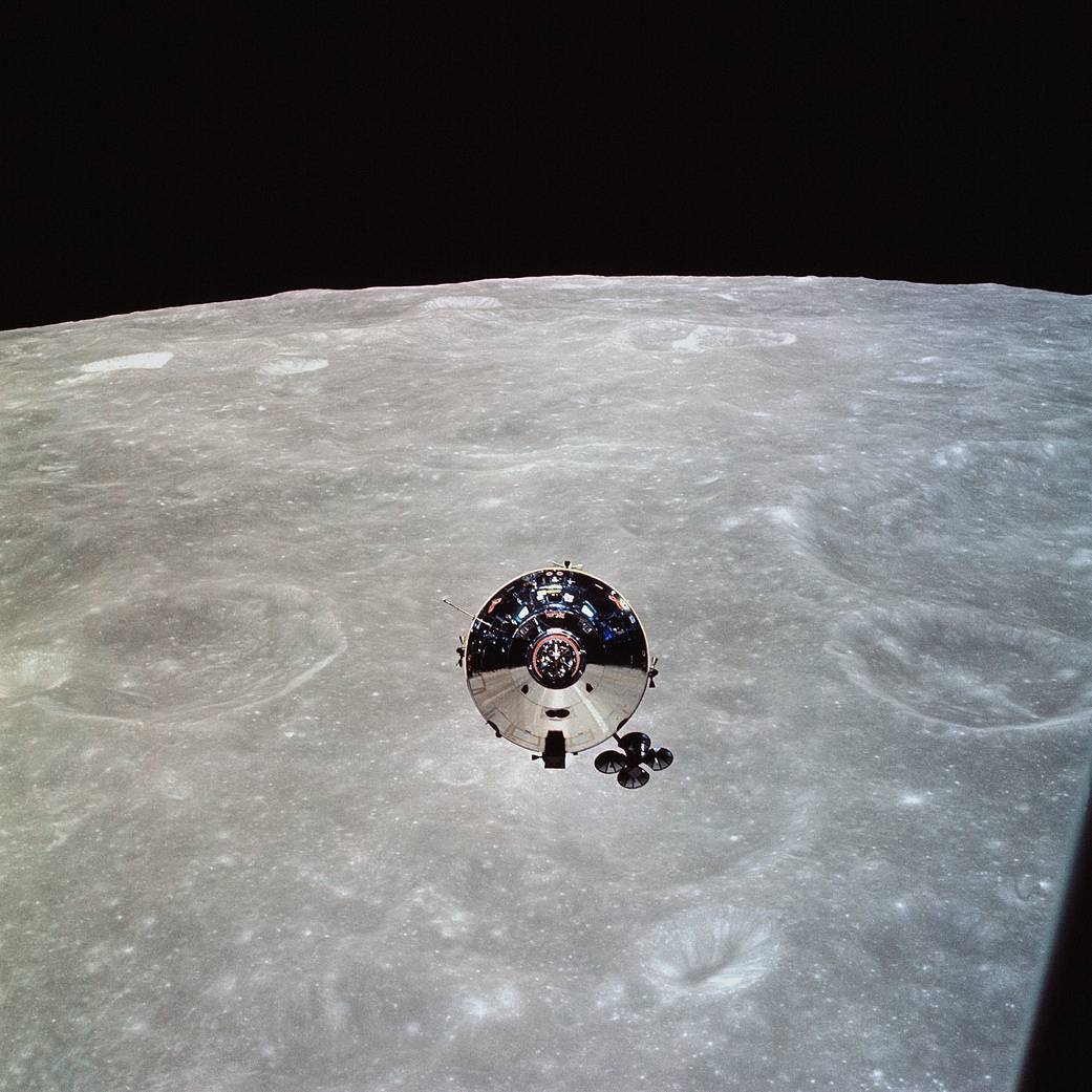 The Apollo 10 Command Module is seen backdropped by the Moon as seen by the astronauts in the lunar module.
