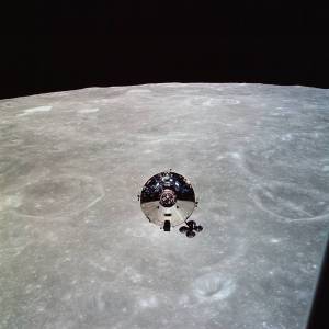 The Apollo 10 Command Module is seen backdropped by the Moon as seen by the astronauts in the lunar module.