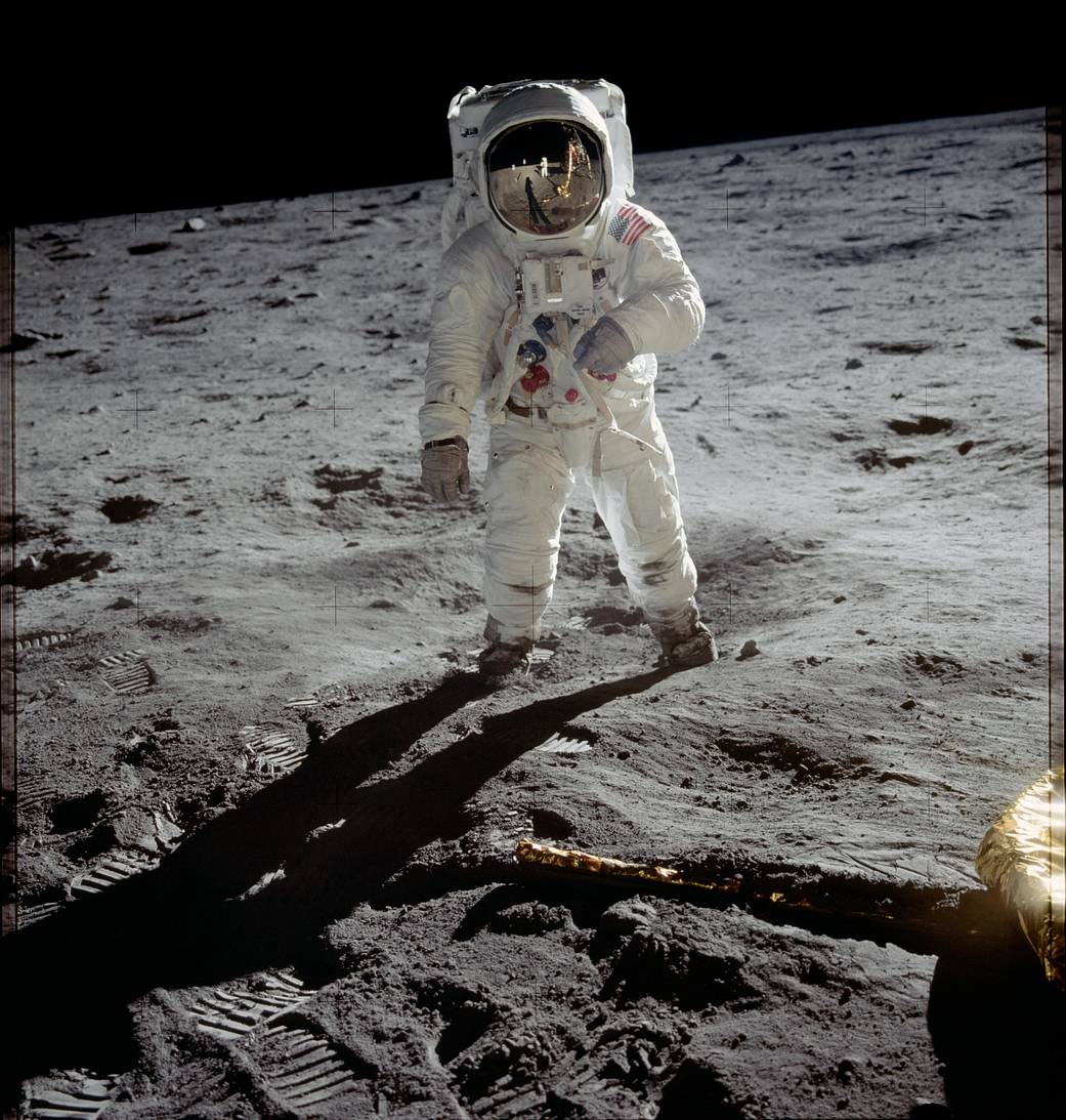 Astronaut Buzz Aldrin in spacesuit walking on lunar surface