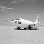 Black and while photos of an aircraft on a lake bed.