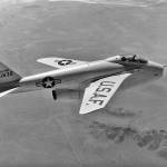 X-5 in flight with wings swept back.