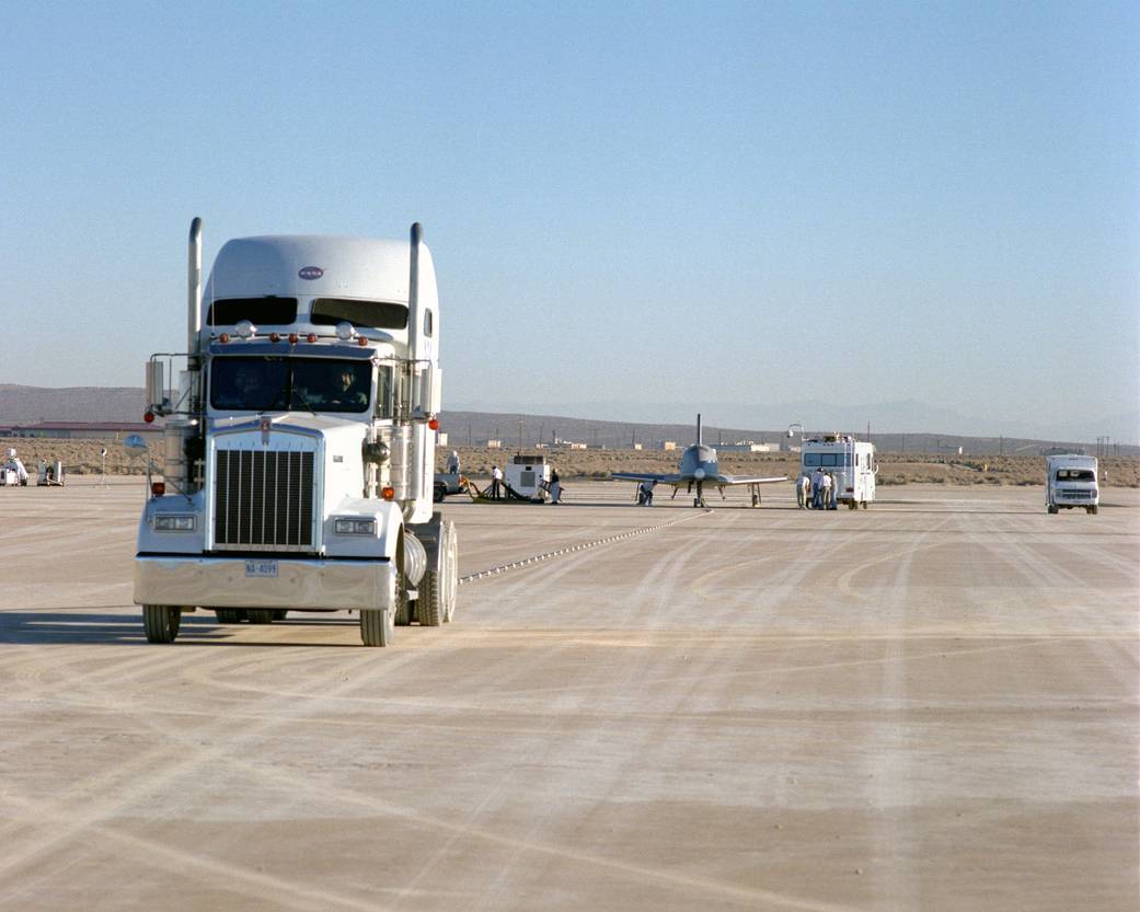 X-34 Technology Demonstrator Towed Behind Semi-Truck