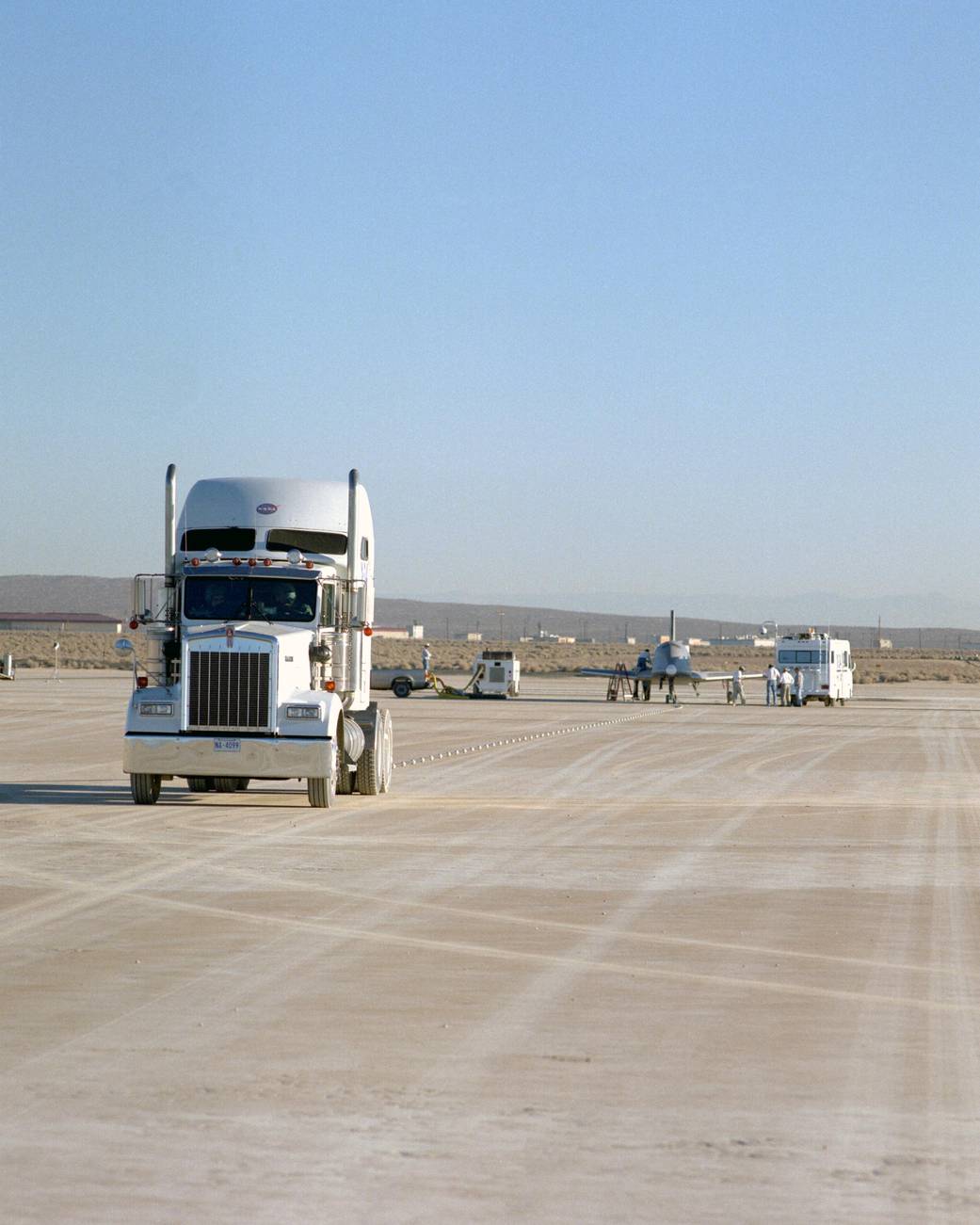 X-34 Technology Demonstrator Towed Behind Semi-Truck
