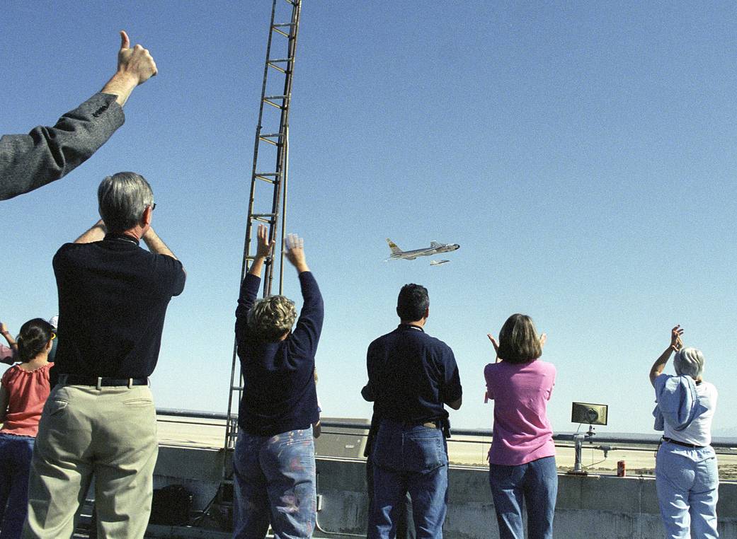 Employees Celebrate B-52 Fly-By after X-43A Launch