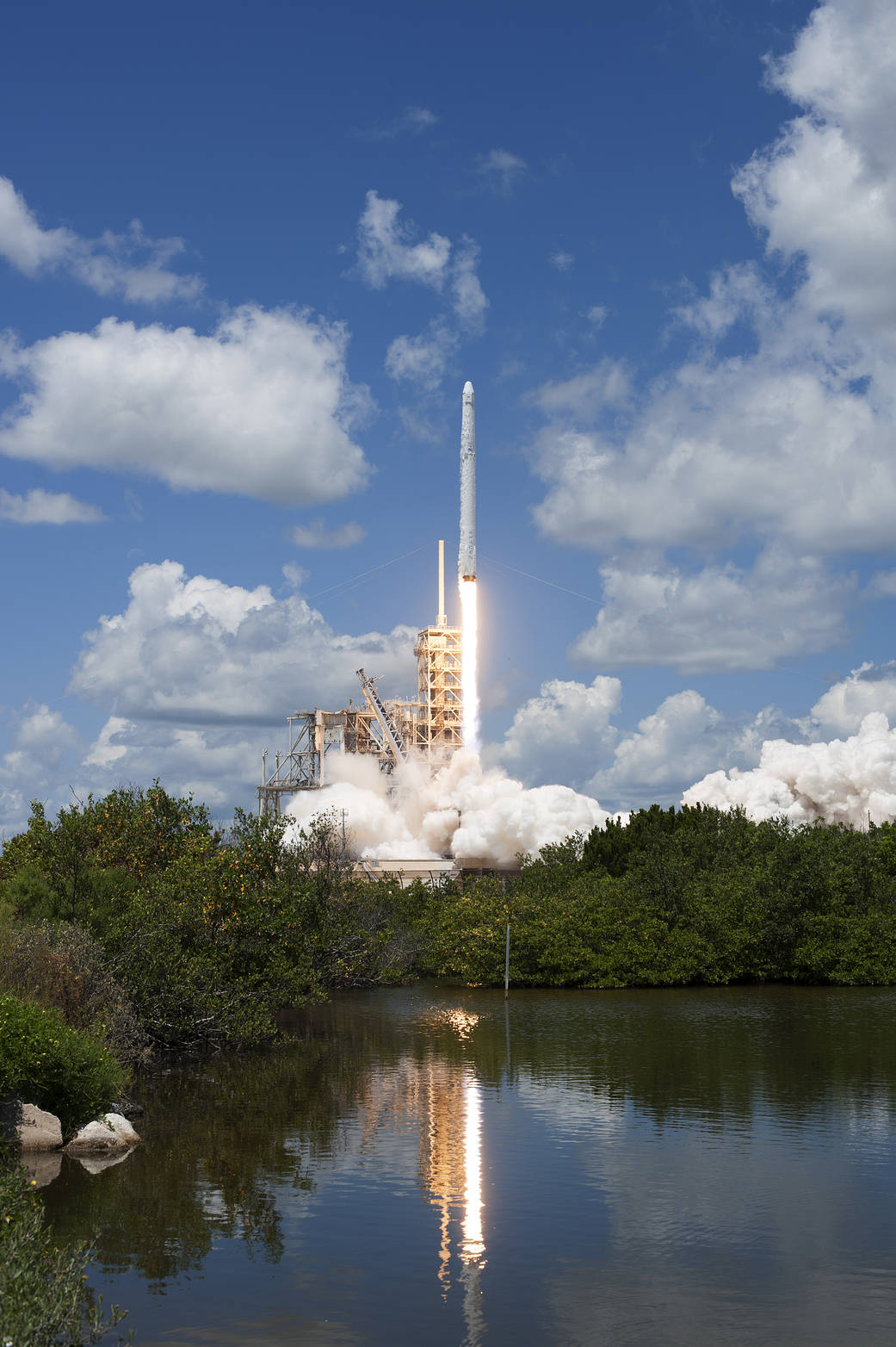  The Falcon 9 launch vehicle lifts off carrying the CRS-12 to the International Space Station